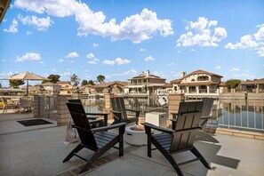 Escape to your own private oasis, where tranquility meets excitement. Your oversized backyard opens up to a serene lake, accessible via your private dock along with a firepit.
