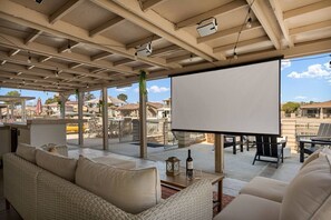 The cozy sectional seating area invites you to relax and recharge, while watching one of your favorite movies on our projector screen.