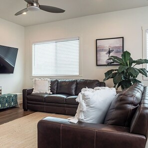 Living room with plenty of seating and free streaming services 