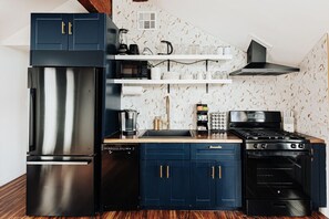 Culinary enthusiasts will delight in the fully equipped, designer-updated kitchen that awaits them.