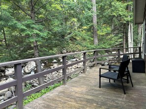 Take in nature and enjoy a hot beverage overlooking the roaring brook.