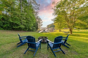 Unwind in the front yard by the firepit with seating for 4. 