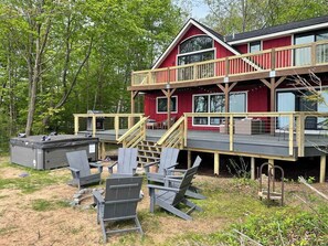 Hot tub and fire pit area near the back decks.  Decks were just rebuilt and will be stained in the fall. 