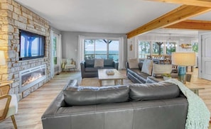Open concept living room with lake views.