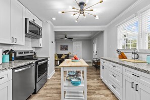 Gourmet kitchen open to the living room and dinning area.
