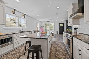 Fully Stocked Gourmet Kitchen with coffee station.