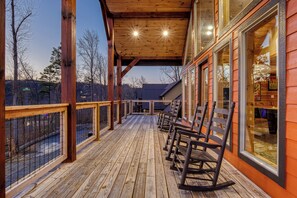 Smoky Mountain Cabin “The Manor at Burg Hill” – Covered front deck with rocking chairs