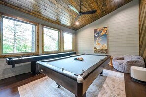 Game room with pool table and shuffle board!