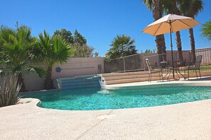 Large cool deck w. pool table and lounge chairs