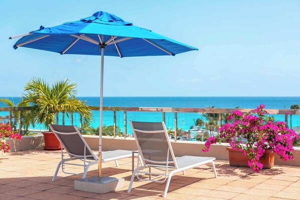 Watch approaching planes from the pool deck while catching rays.