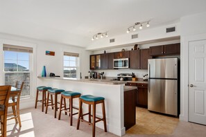 SEV405: The Sand Dollar | Kitchen Area - Island Seating for 4