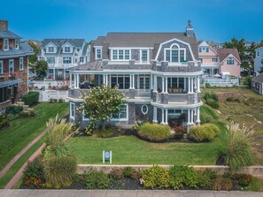 Enjoy breathtaking ocean views from this 5-bedroom unit occupying the second and third floors of a stunning beachfront home in Cape May. 