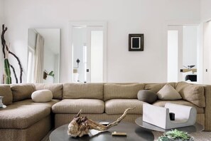 Living room with two bedrooms behind pocket doors