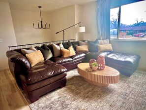 Super comfy sectional with lots of pillows for lounging in front of the 75 in TV