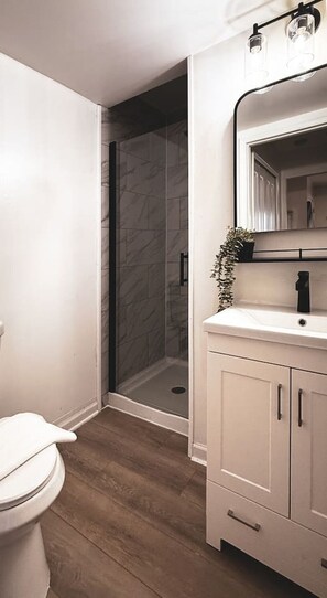 You feel a sense of calm as you enter the bathroom, where the thoughtful design and high-quality materials create a serene environment.