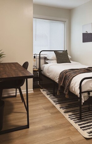 You’ll feel enveloped in warmth in this charming room with its rich wood accents and inviting bed. Wake up refreshed, surrounded by rustic coziness, and enjoy the perfect mix of comfort and natural vibes