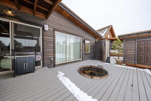 Relax and unwind in the private hot tub 