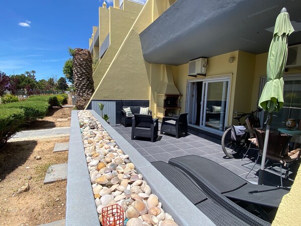 Large Balcony with modern outdoor furniture including Dining Table & Chairs.