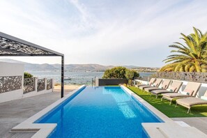 Heated infinity pool with sea view in Luxury Villa Destiny Ciovo with heated pool at the beach