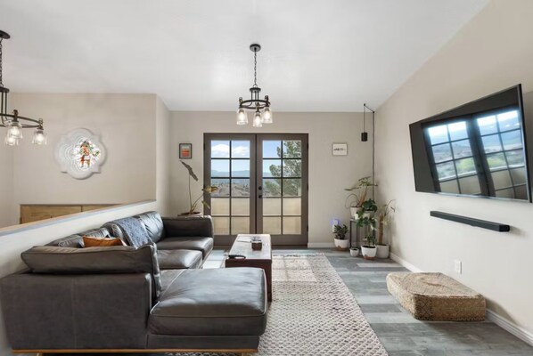 Main living room with 75" smart TV and Sonos sound