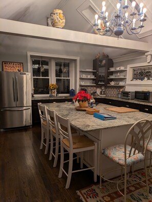 Fully equipped kitchen with large island that seats five people.
