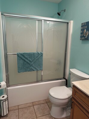 Guest bathroom with tub/shower.