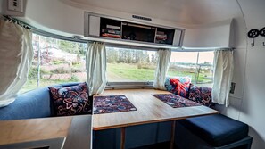 Nice, large dining table with cozy seating. This also folds into a bed. 