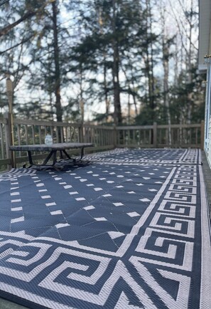 Porch but doesn't show the grill and summer outdoor furniture