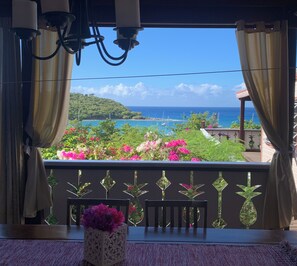 The second patio with big dining table and view of the beach