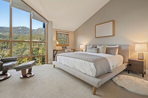 Main bedroom - spacious King bed, dedicated workspace, reading nook with floor to ceiling windows, closet and ensuite bath!