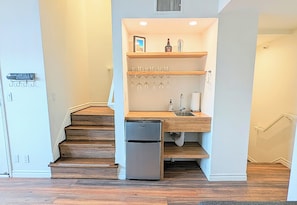 Mini Bar in the Living Room. Stairs lead up to the Bedroom & down to the Kitchen