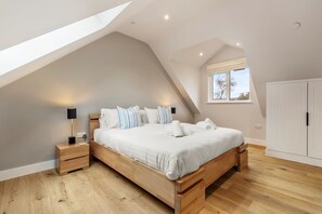The super king size bedroom at The Little House in Oxwich, Gower
