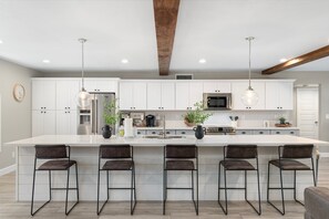 Chef Kitchen with counter bar seating 