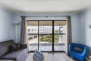 Bright living area with balcony access and comfy seating!