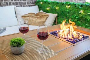 Wind down on the private balcony equipped with a gas firepit 