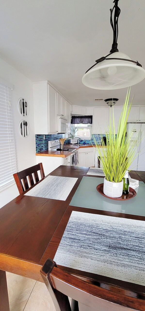 Open Kitchen with sliding door you can see the ocean and sunset. 