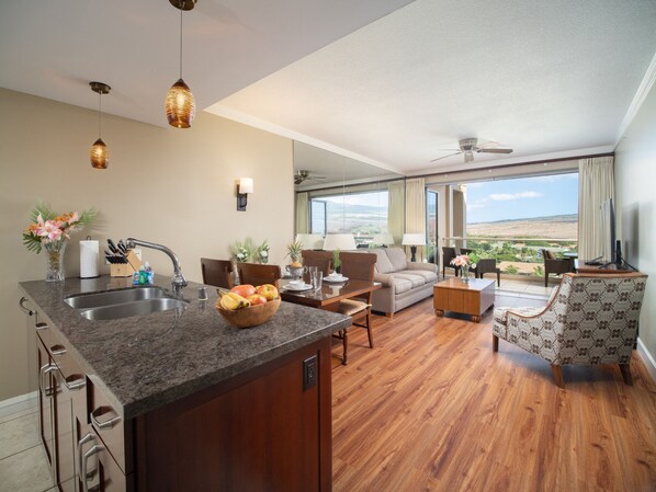 Enjoy the open-concept layout with a modern kitchen, stylish dining area, and a cozy living room leading to a private balcony with stunning views.