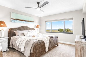 Master bedroom with king bed and direct ocean views for a relaxing retreat.