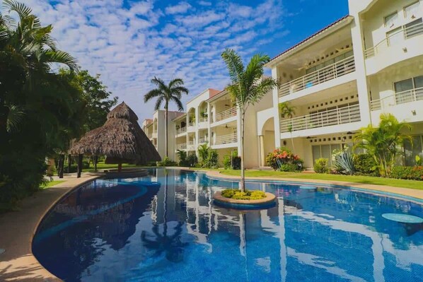 The pool area is a tropical oasis