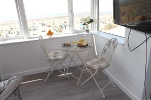 Enjoy breakfast in the master bedroom with a panoramic view of Camber Sands.