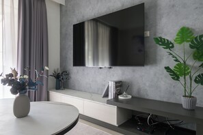 Cozy & Stylish Living Room:
• 65" Smart TV w/Channels
• Open Space w/Dining Area