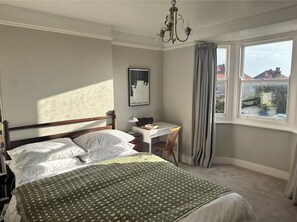 Master bedroom with King size double bed, distant sea views. 