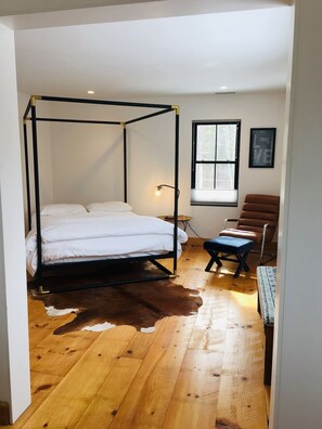 Primary upstairs bedroom; Queen sized bed; Full bathroom attached