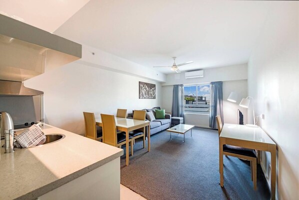 The central kitchen is compact and equipped for light meals with a fridge, microwave, kettle and dishwasher for easy clean-up.