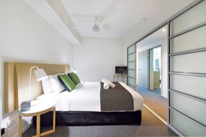 The bedroom comes with a premium queen-sized bed, topped with hotel quality linens for your stay. There is ample wardrobe space for your belongings and an ensuite bathroom.
