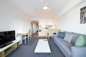 The main living room features a four-person dining table creating the space to come together for a shared meal. You’ll also find abundant eateries on your doorstep.

