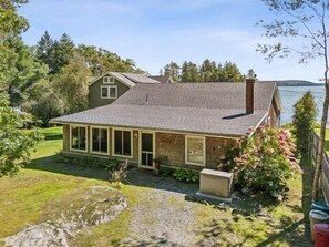 The entrance to the cottage is right off of the driveway.