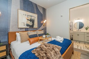 Primary Bedroom featuring a King Bed, closet, and en-suite bathroom.