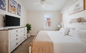 Master bedroom on the second floor with a king size bed, private bathroom and flat screen smart TV