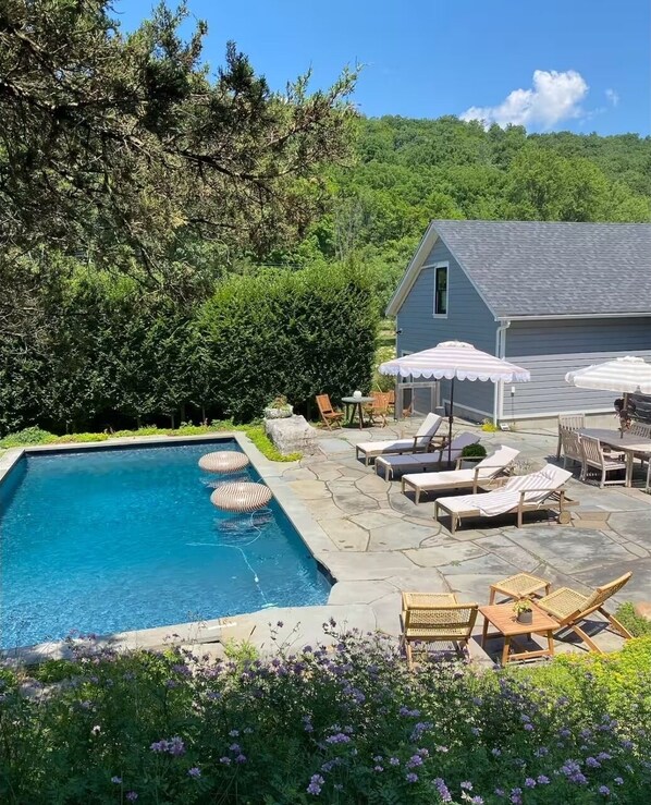 Beautiful pool with privacy hedge
